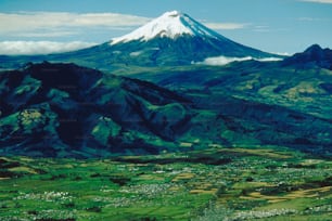 a mountain with a snow capped peak in the distance