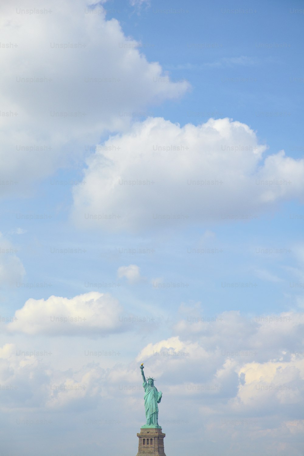 the statue of liberty is in the middle of a field