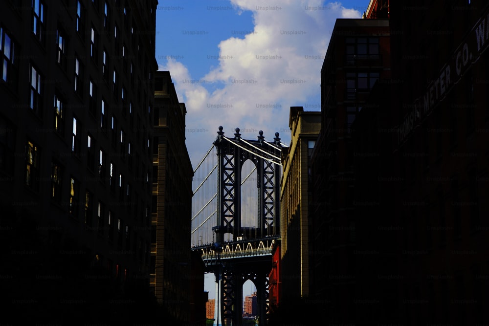 a view of a bridge from a street in a city