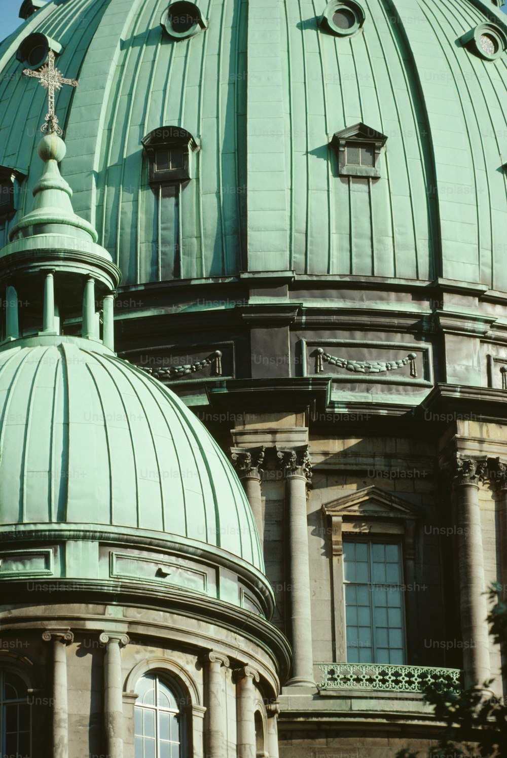a large green dome on top of a building