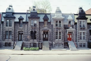 a row of old brick buildings with a red door