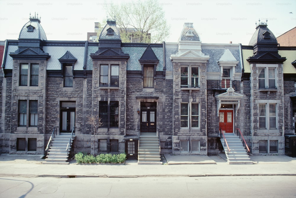 a row of old brick buildings with a red door