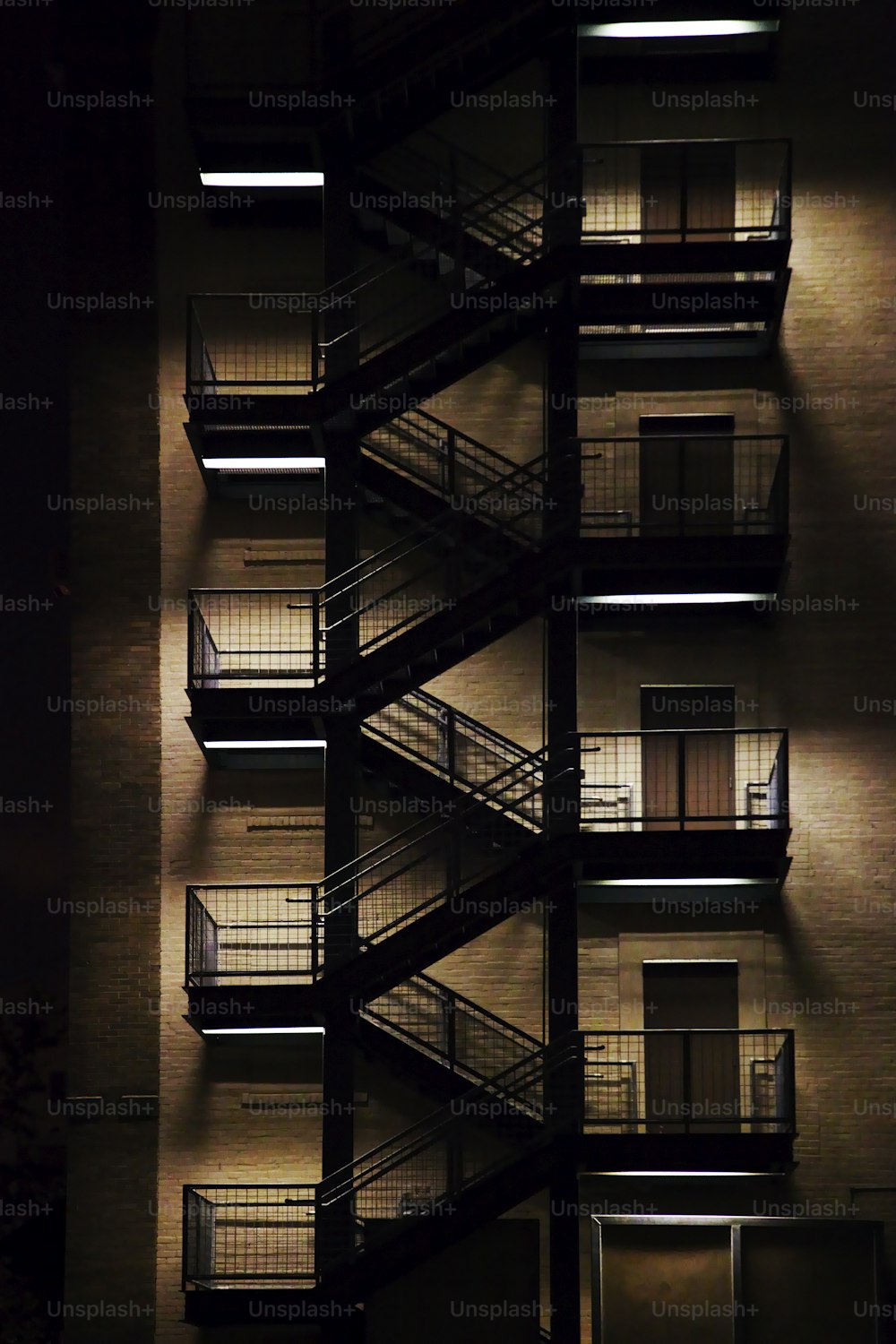 a fire escape is lit up at night