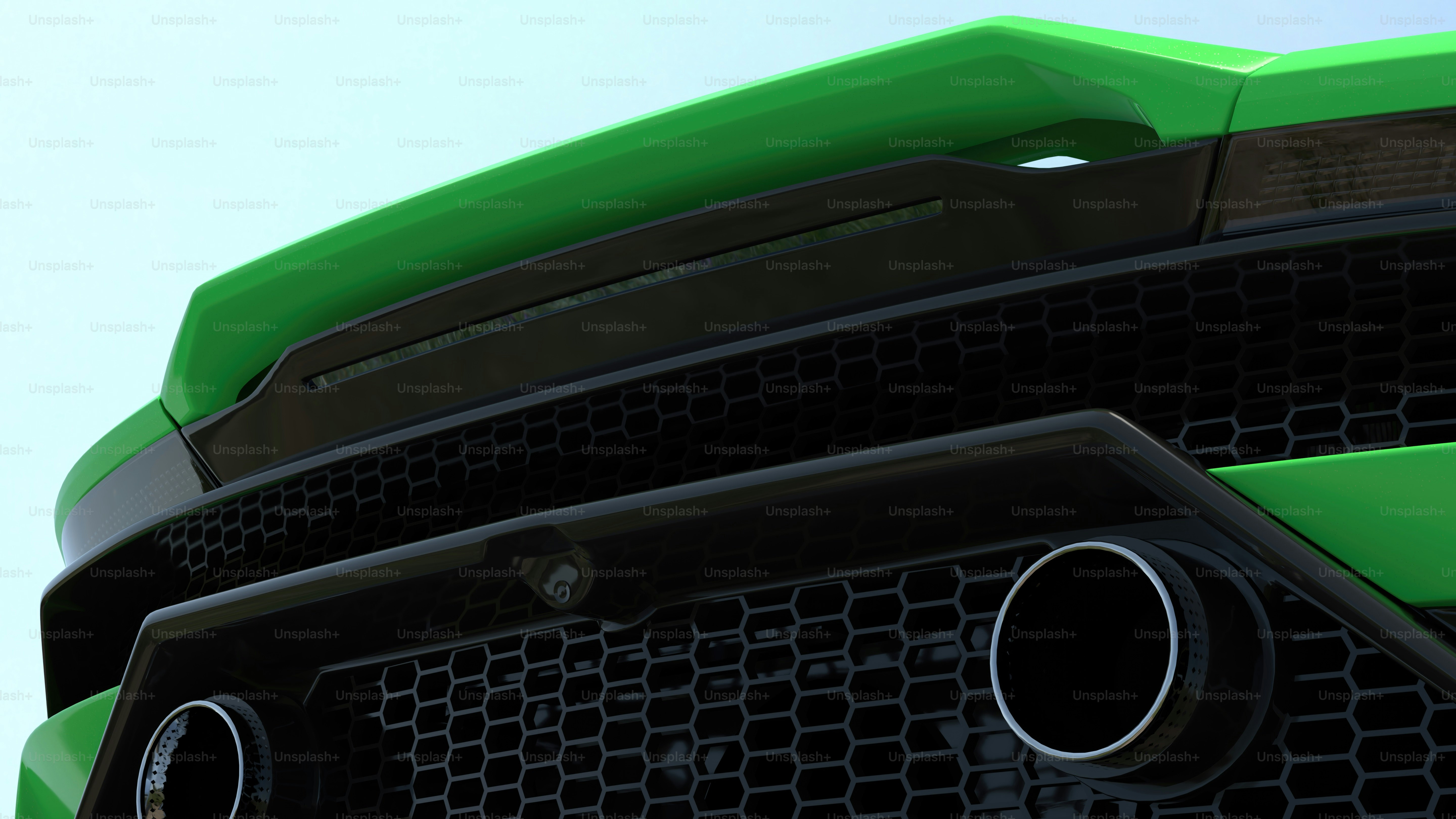a close up of the front of a green sports car
