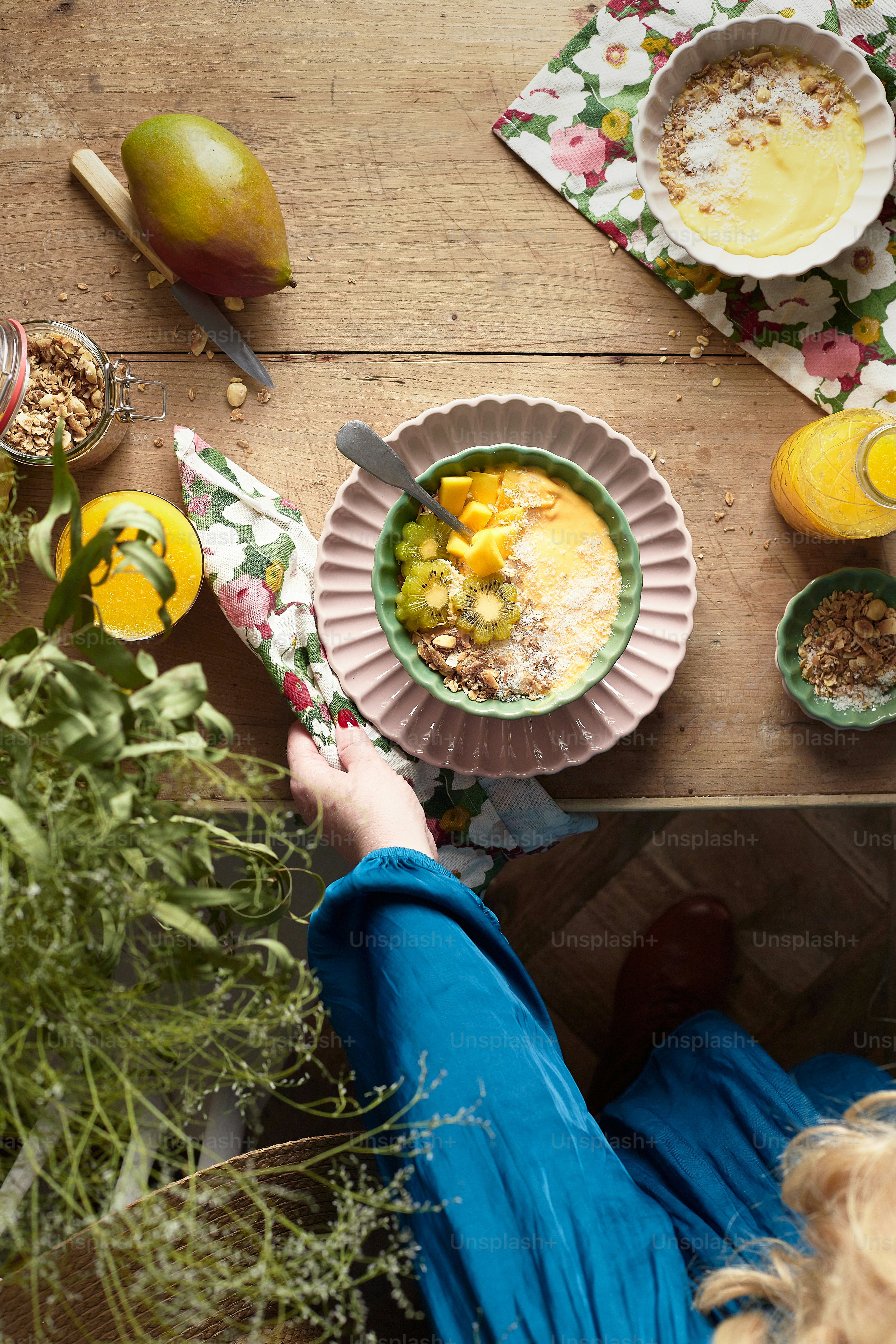 a person sitting at a table with bowls of food