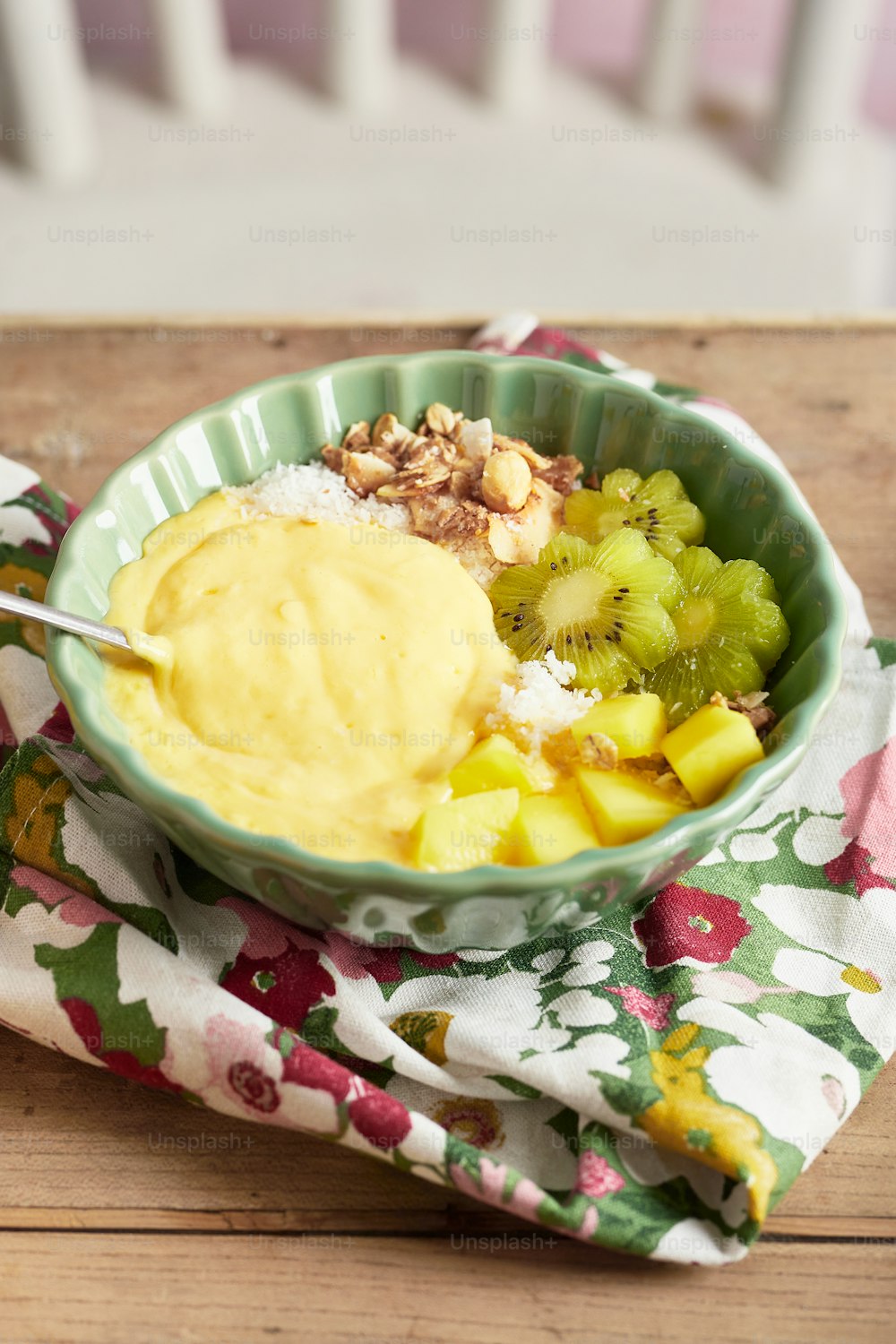 a bowl of fruit with a spoon in it