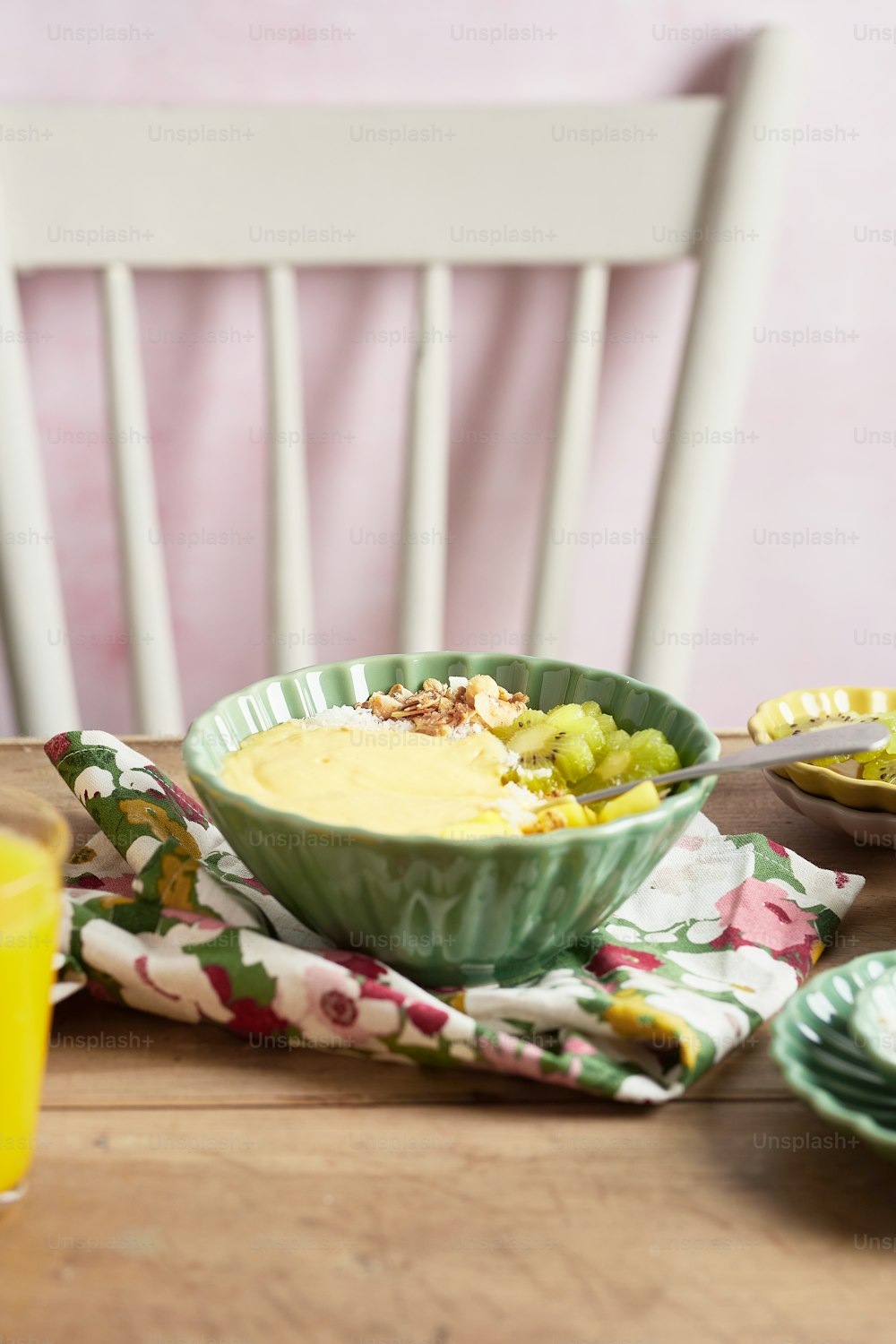 a bowl of food sitting on top of a wooden table