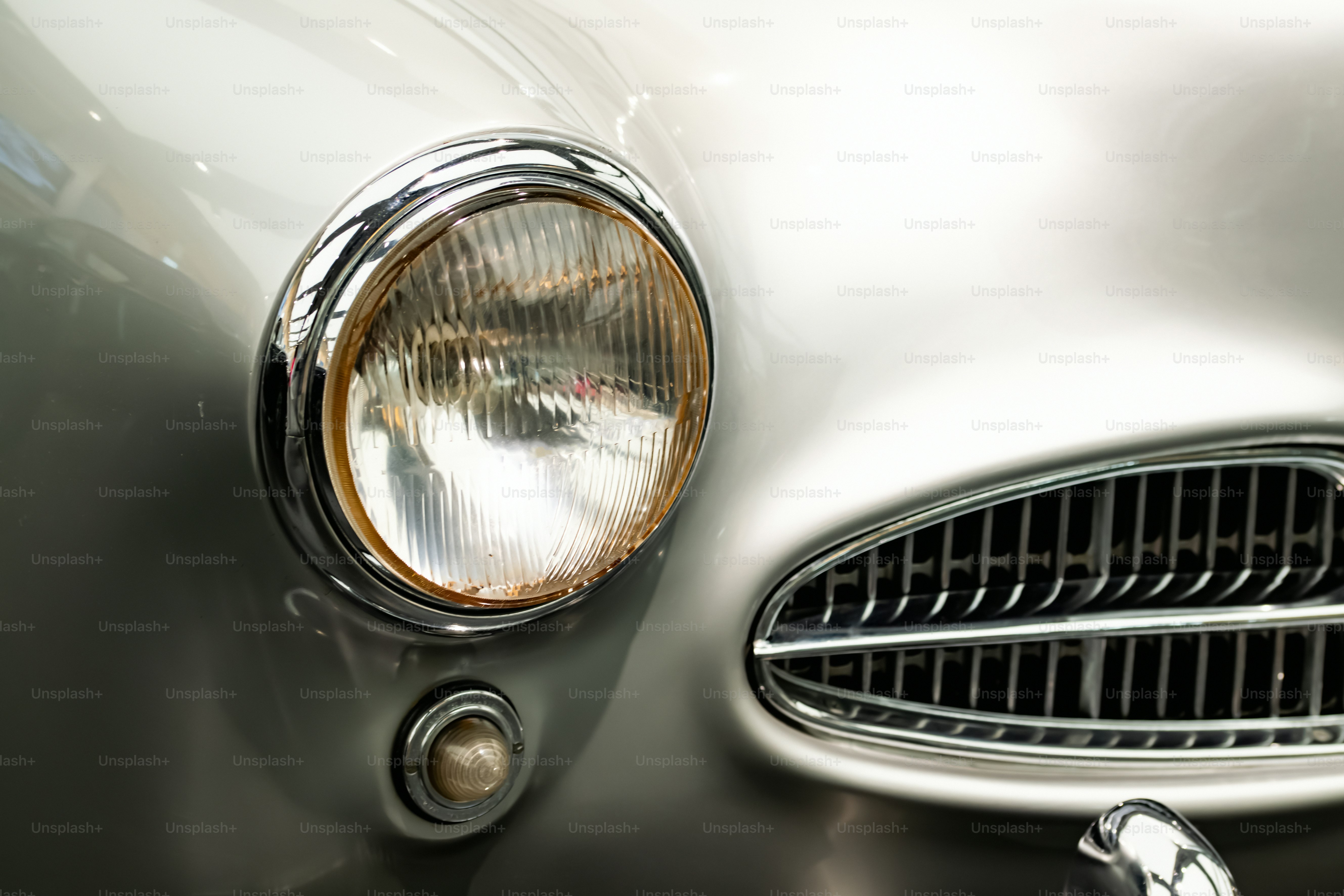 a close up of the front of a classic car