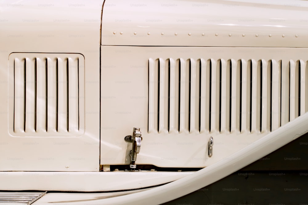 a close up of the front of a white car