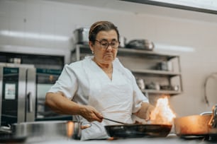 a woman cooking in a kitchen on a stove