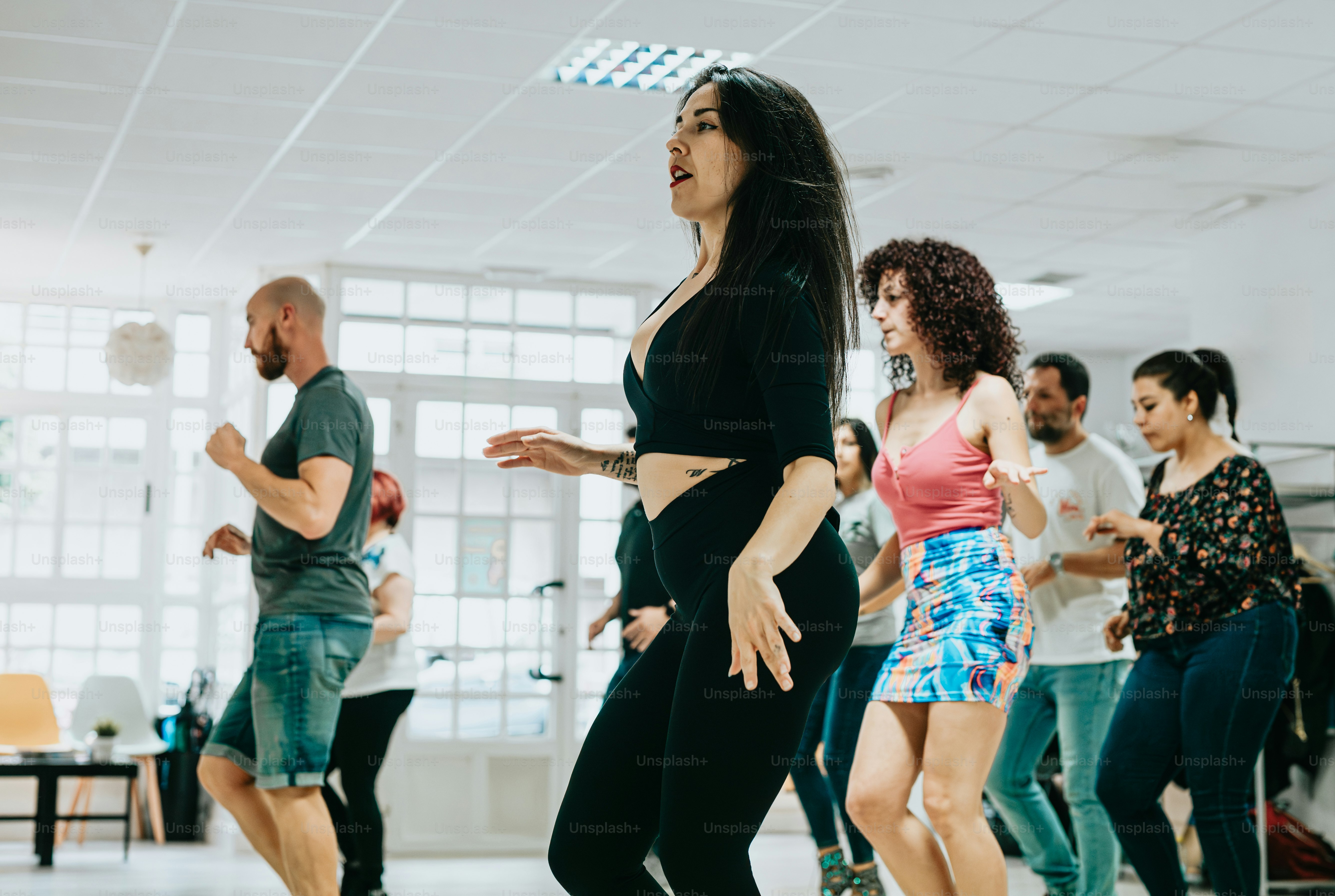 a group of people dancing in a room