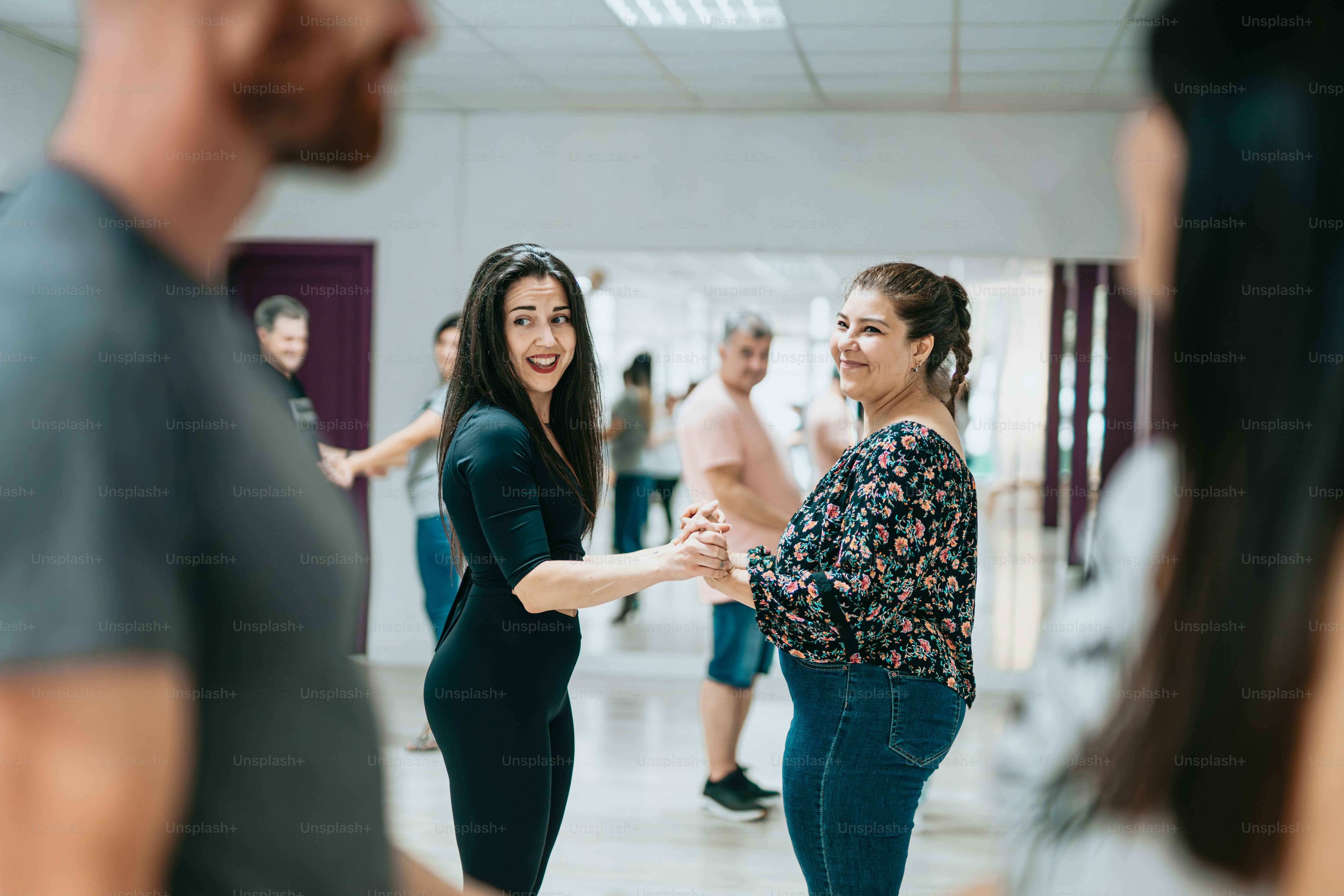 a group of people dancing in a dance studio