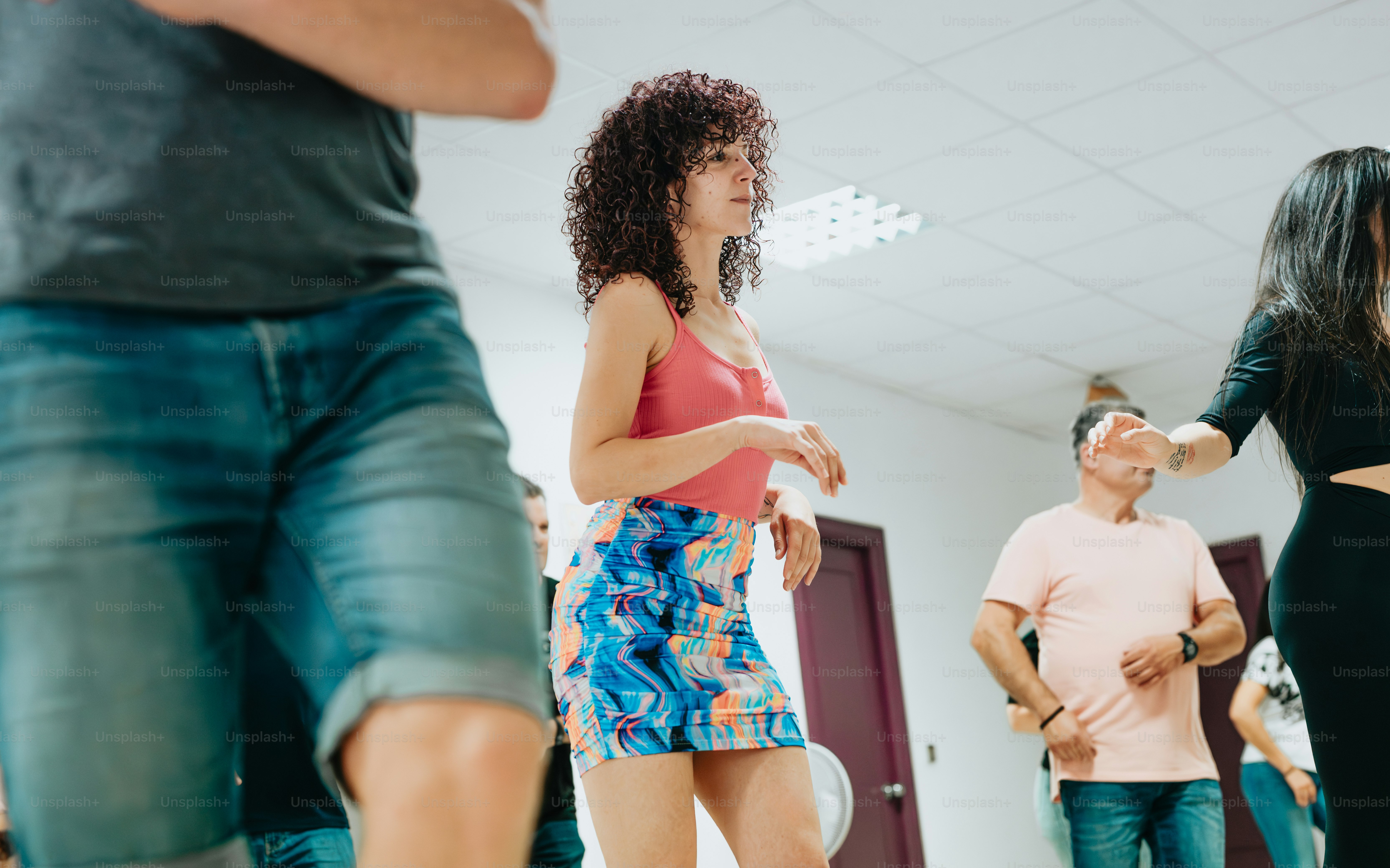 a group of people dancing in a room
