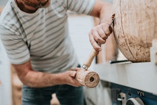 a man working on a piece of wood