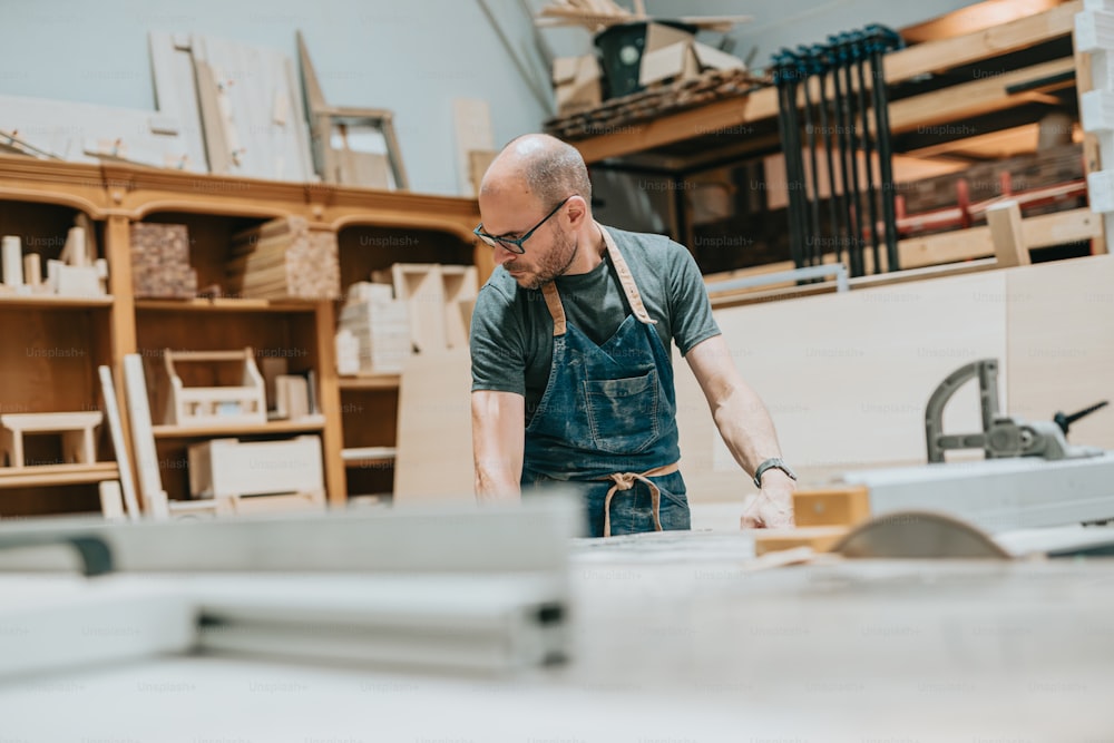 a man working on a piece of wood