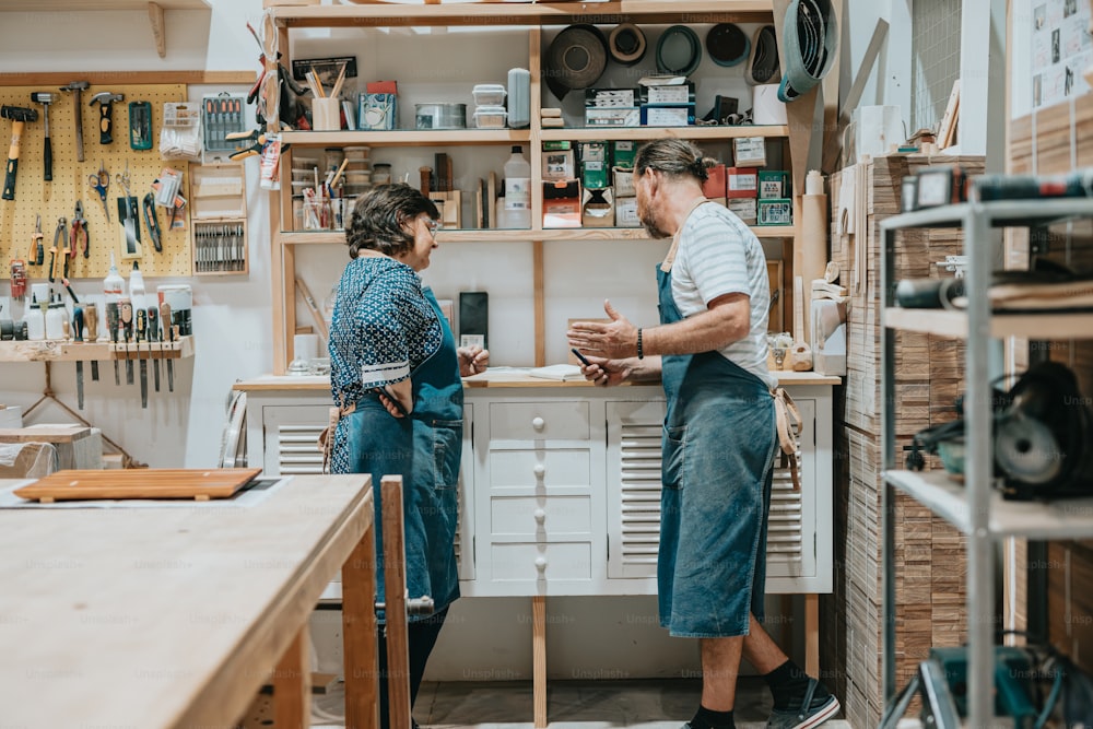 a man and a woman are talking in a shop