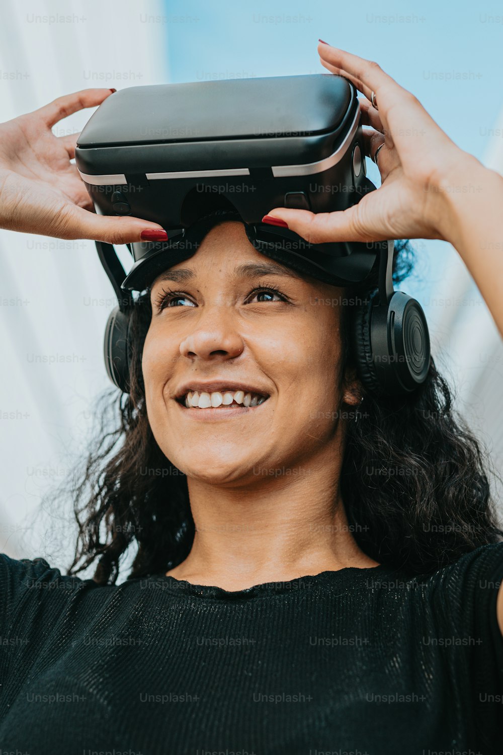 a woman wearing a pair of headphones and a virtual reality headset