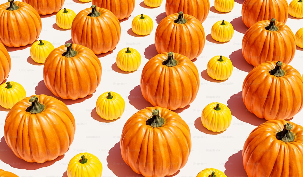 a group of pumpkins sitting on top of a white surface