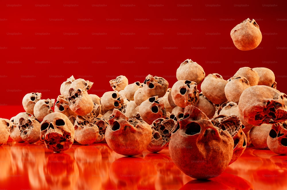 a group of skulls with a red background