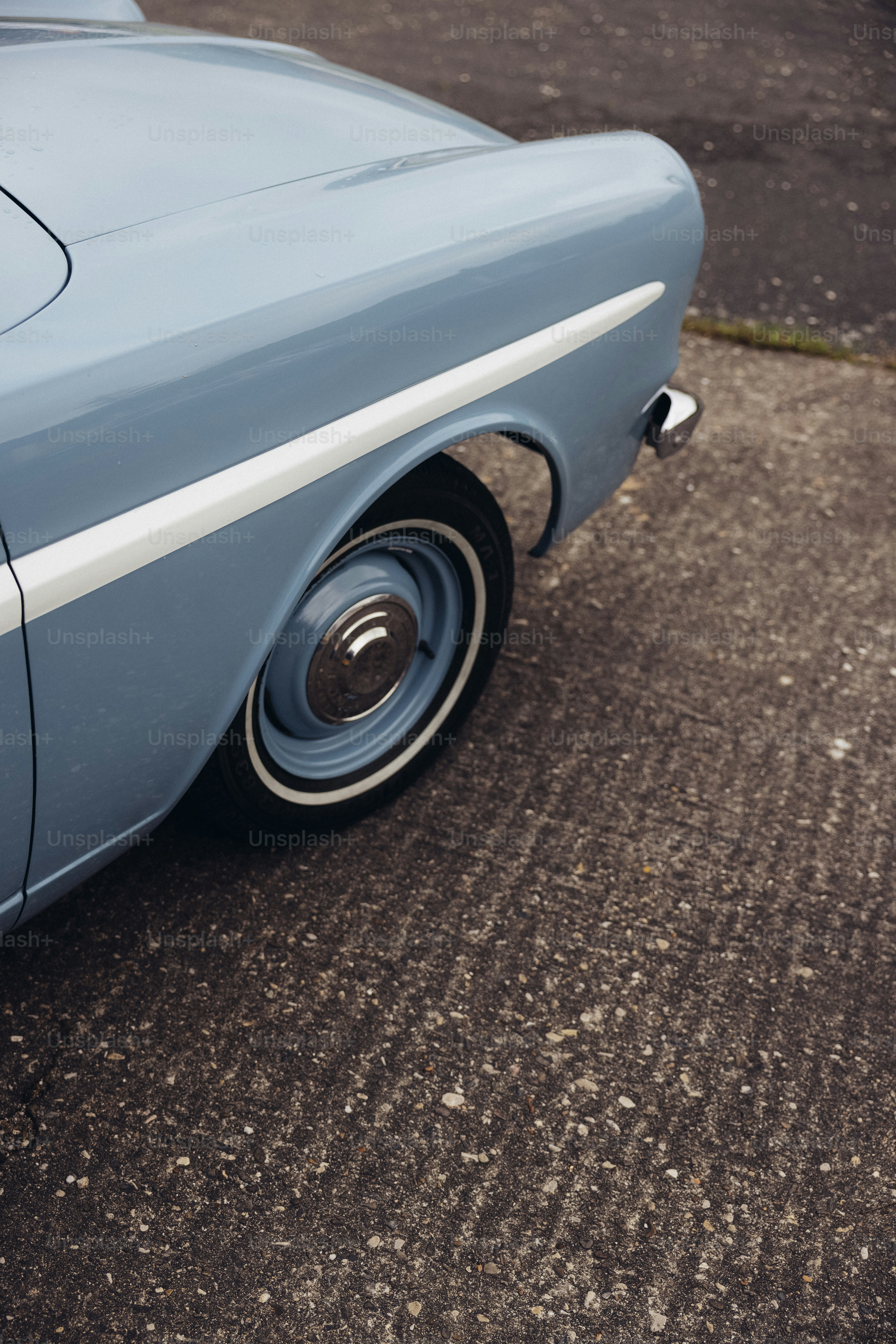 a blue car parked on the side of the road