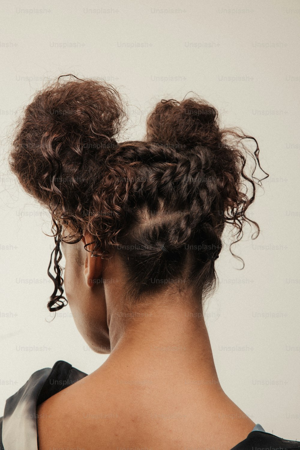 the back of a woman's head with curly hair