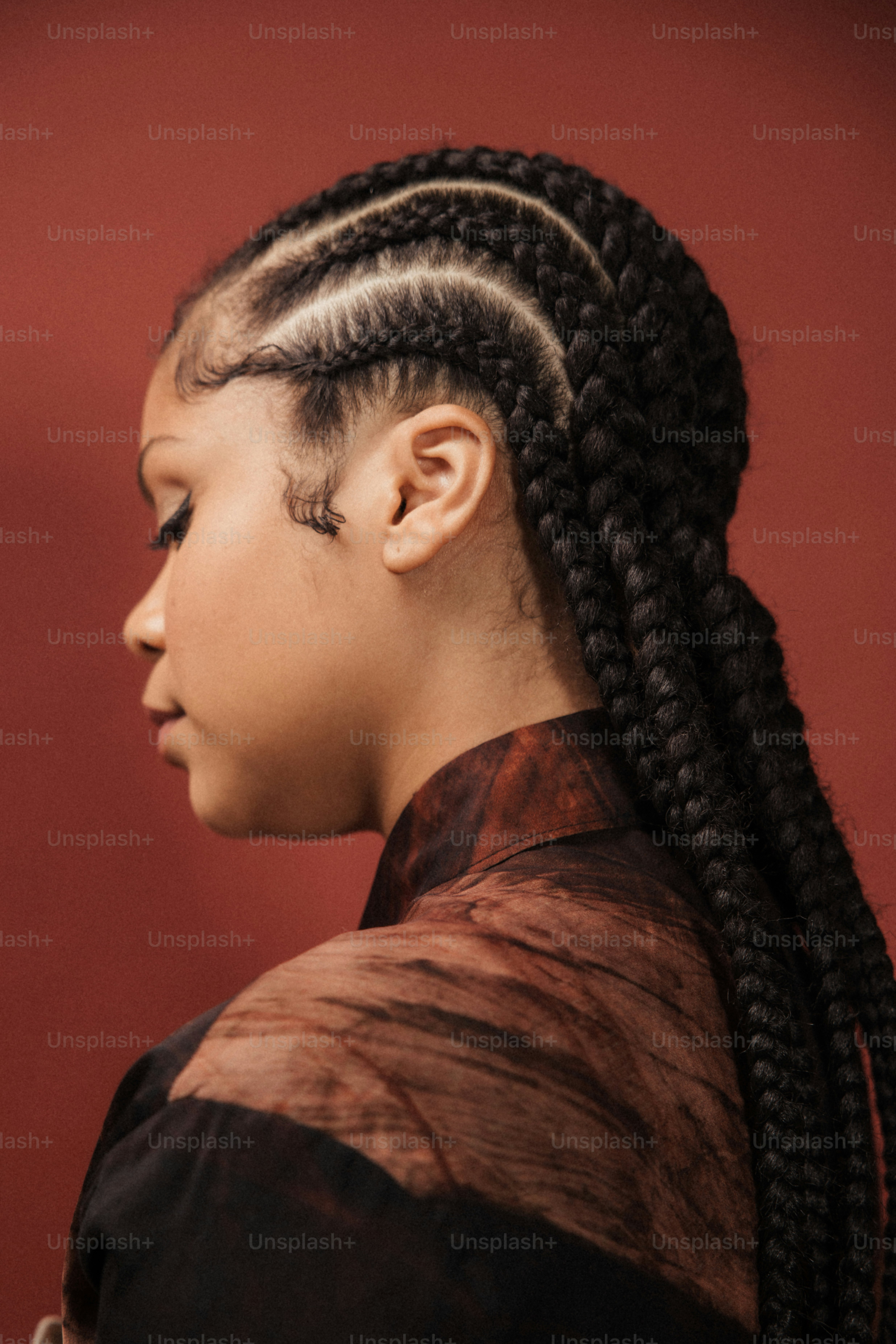 a woman with long braids in her hair