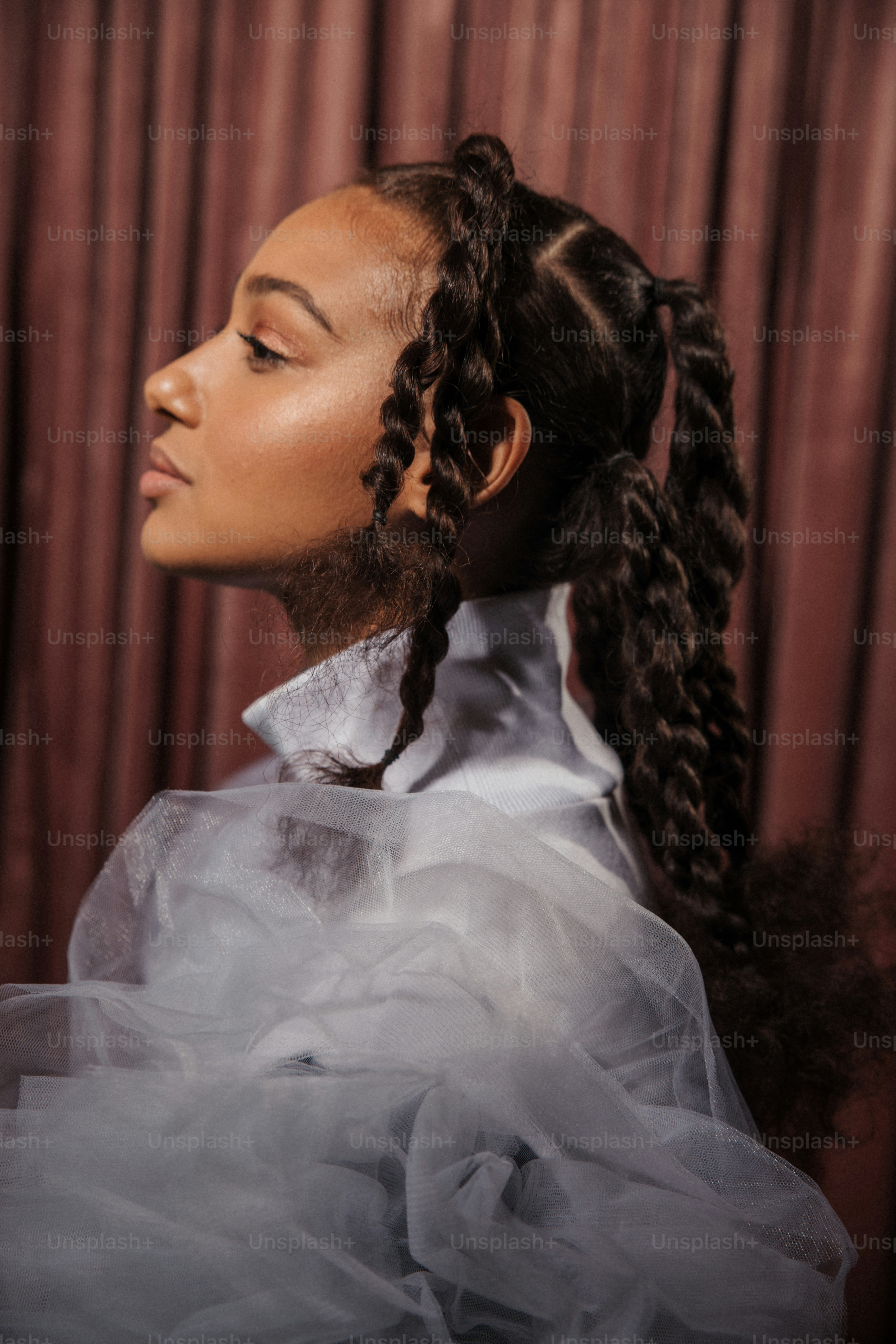 a woman in a white dress with a long braid