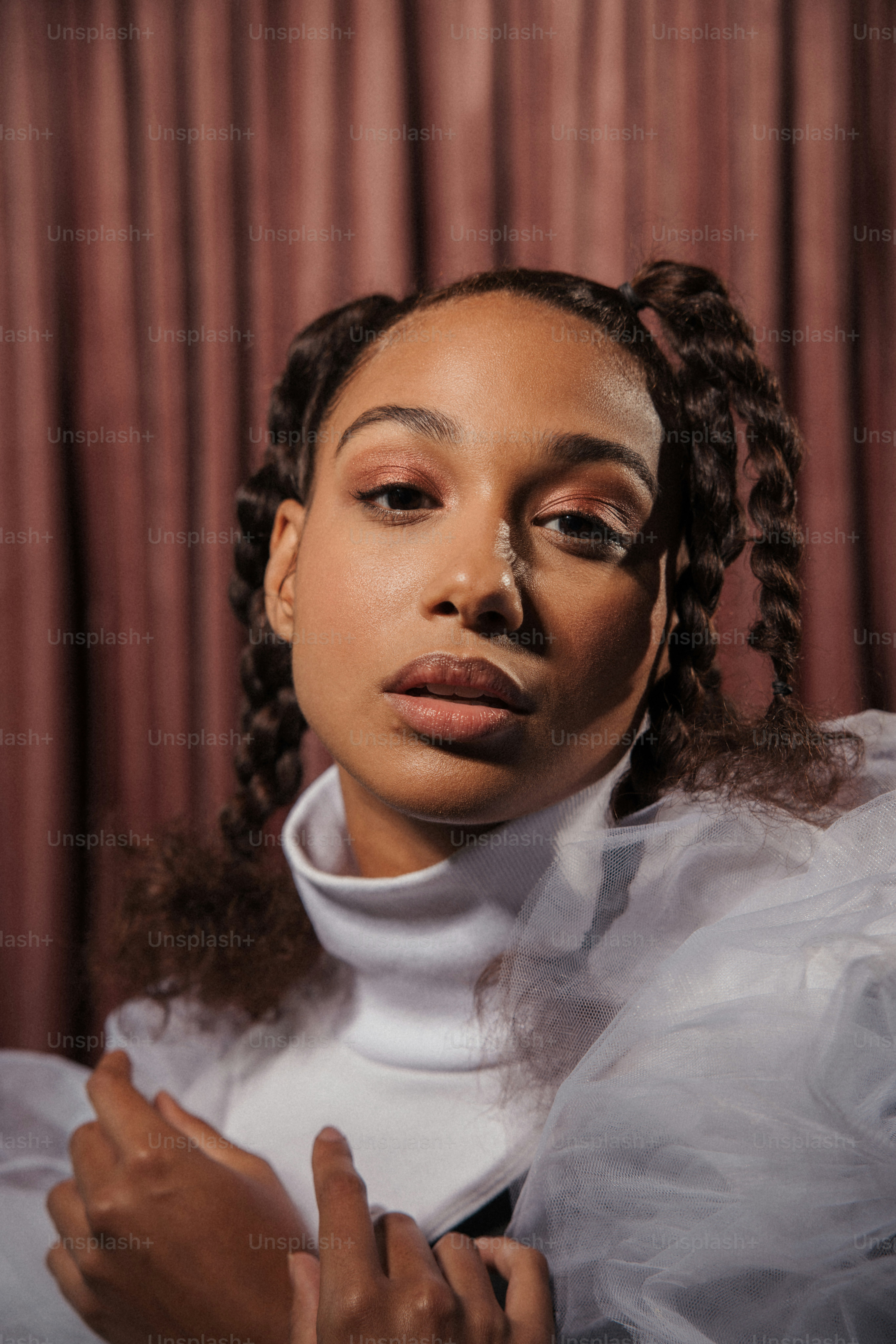 a woman wearing a white shirt and a white dress