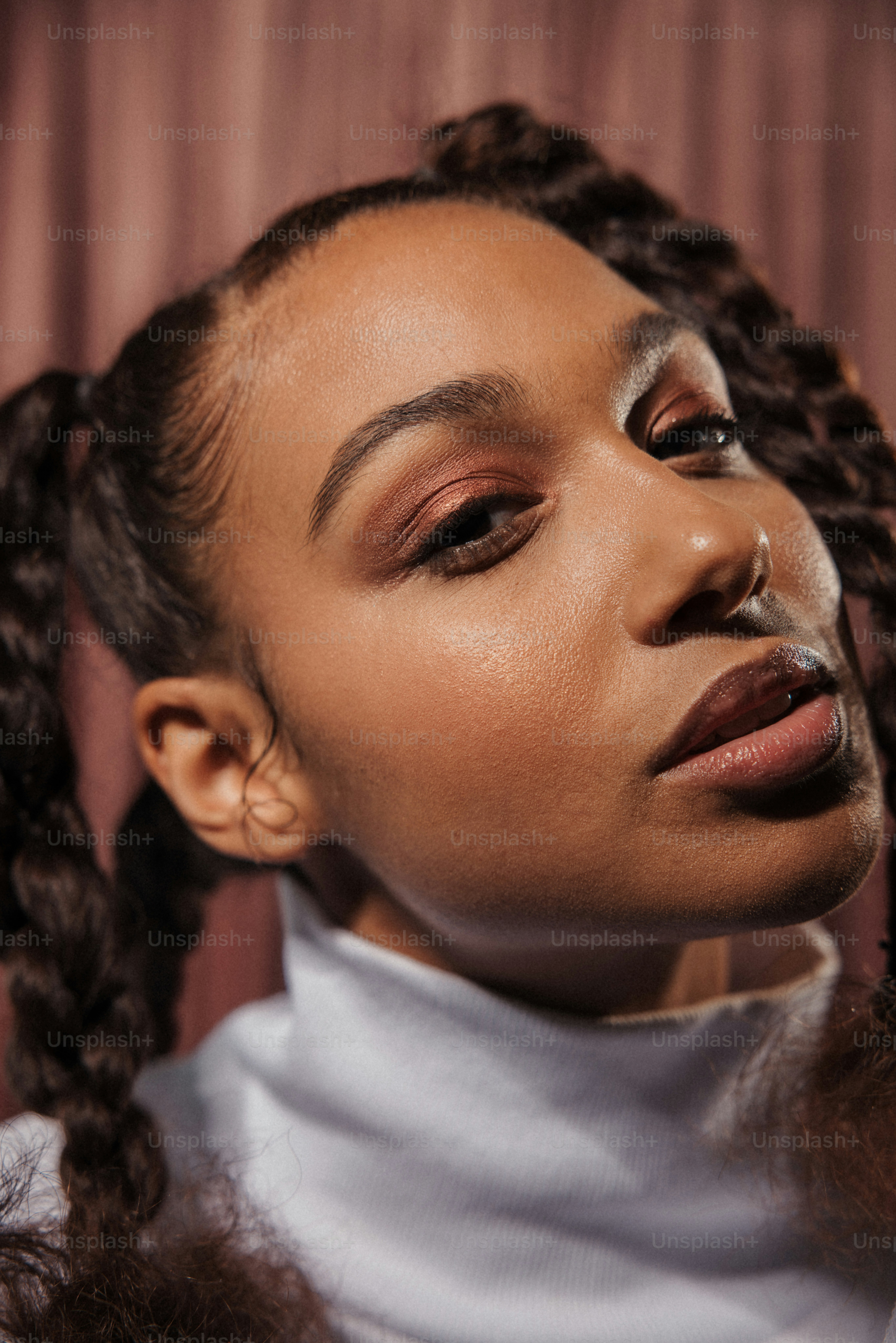 a woman wearing a white turtle neck sweater