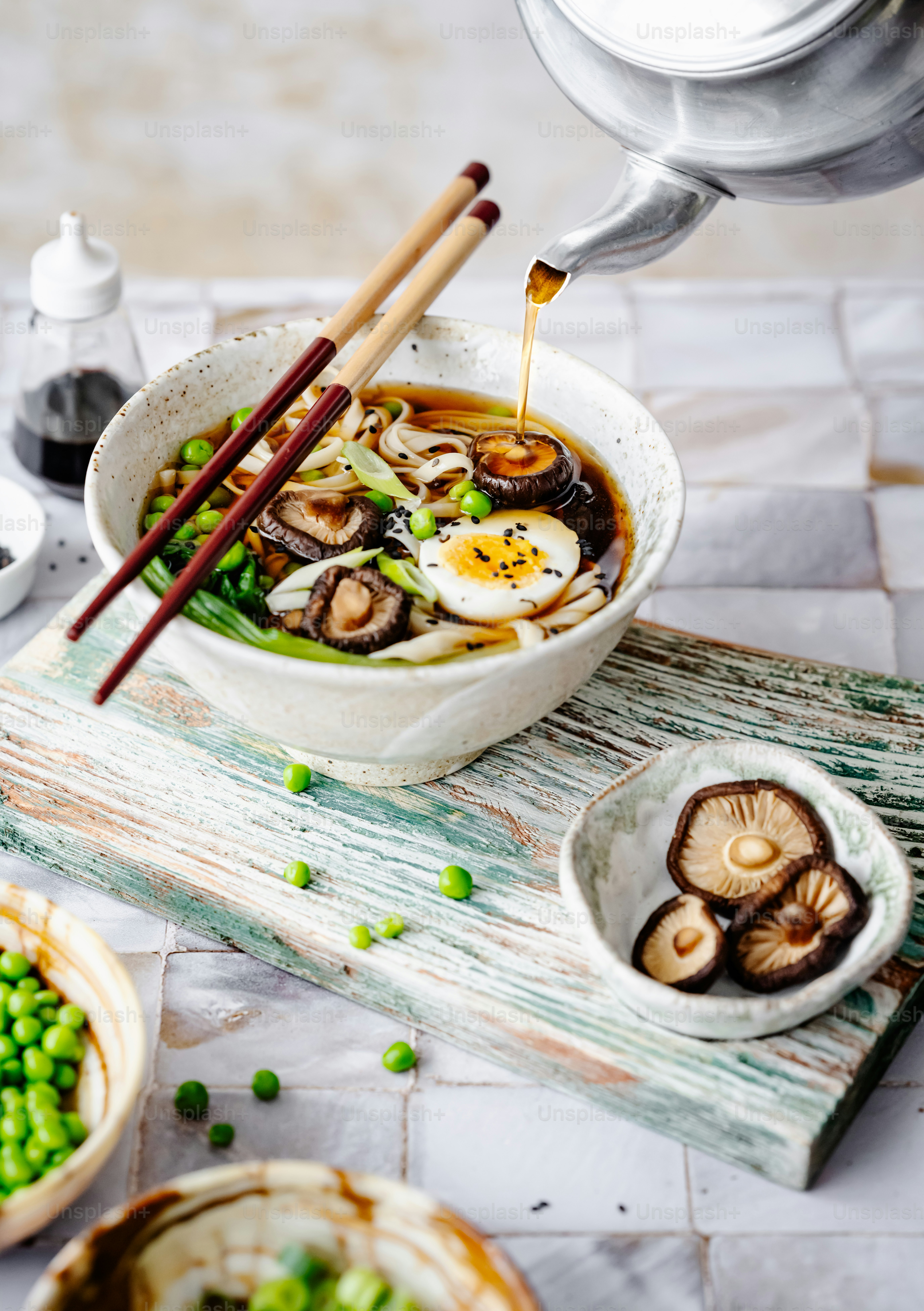 a bowl of soup with mushrooms and peas