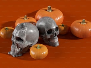 a group of skulls and pumpkins on an orange background