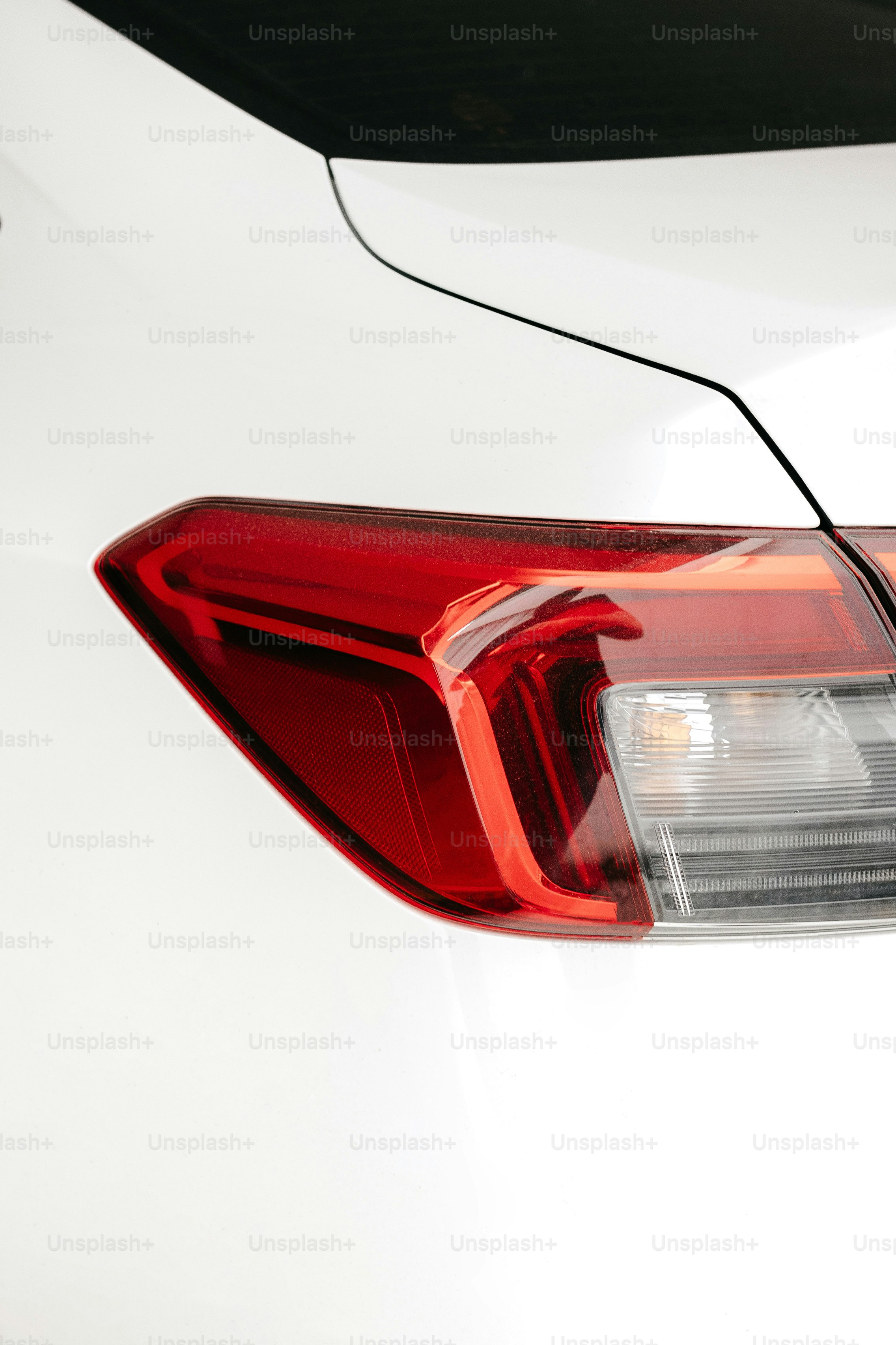 a close up of the tail light of a white car