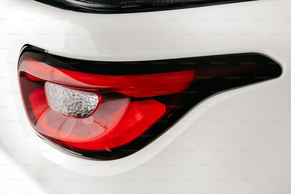 a close up of a white car tail light