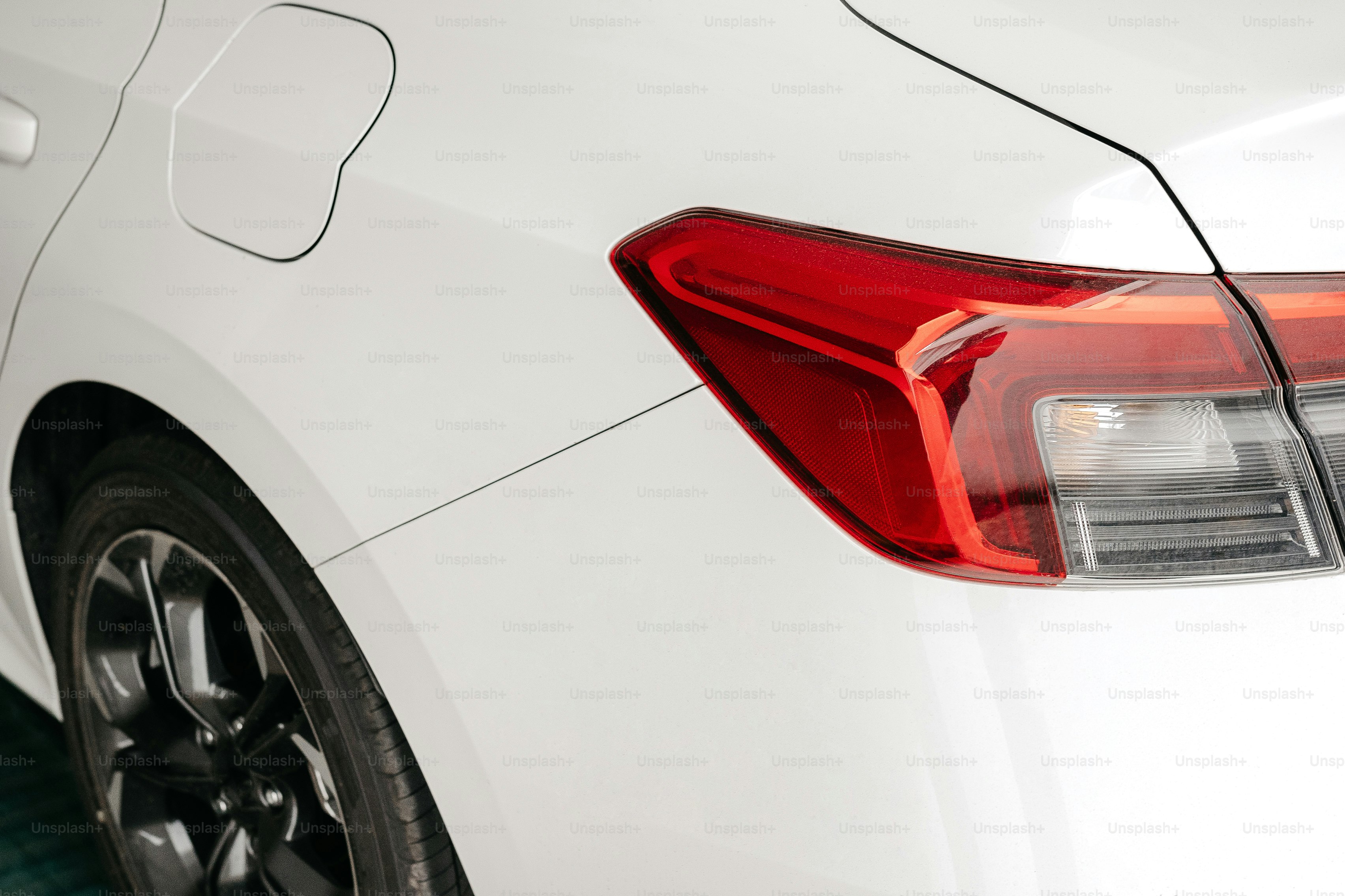 a close up of the tail light of a white car