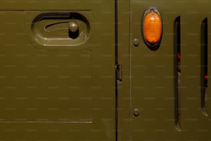 a close up of a door with a light on