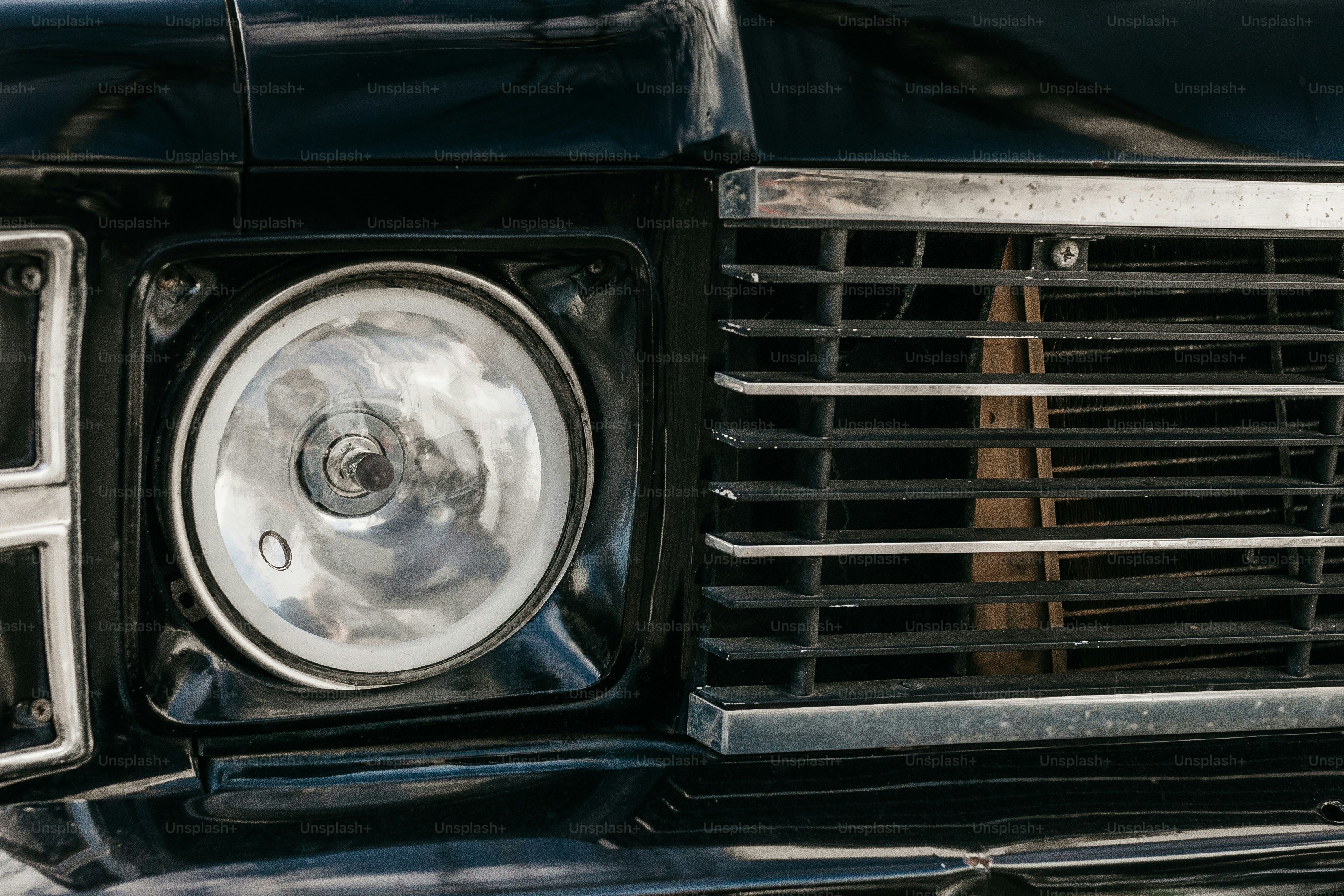 a close up of the front grill of a classic car