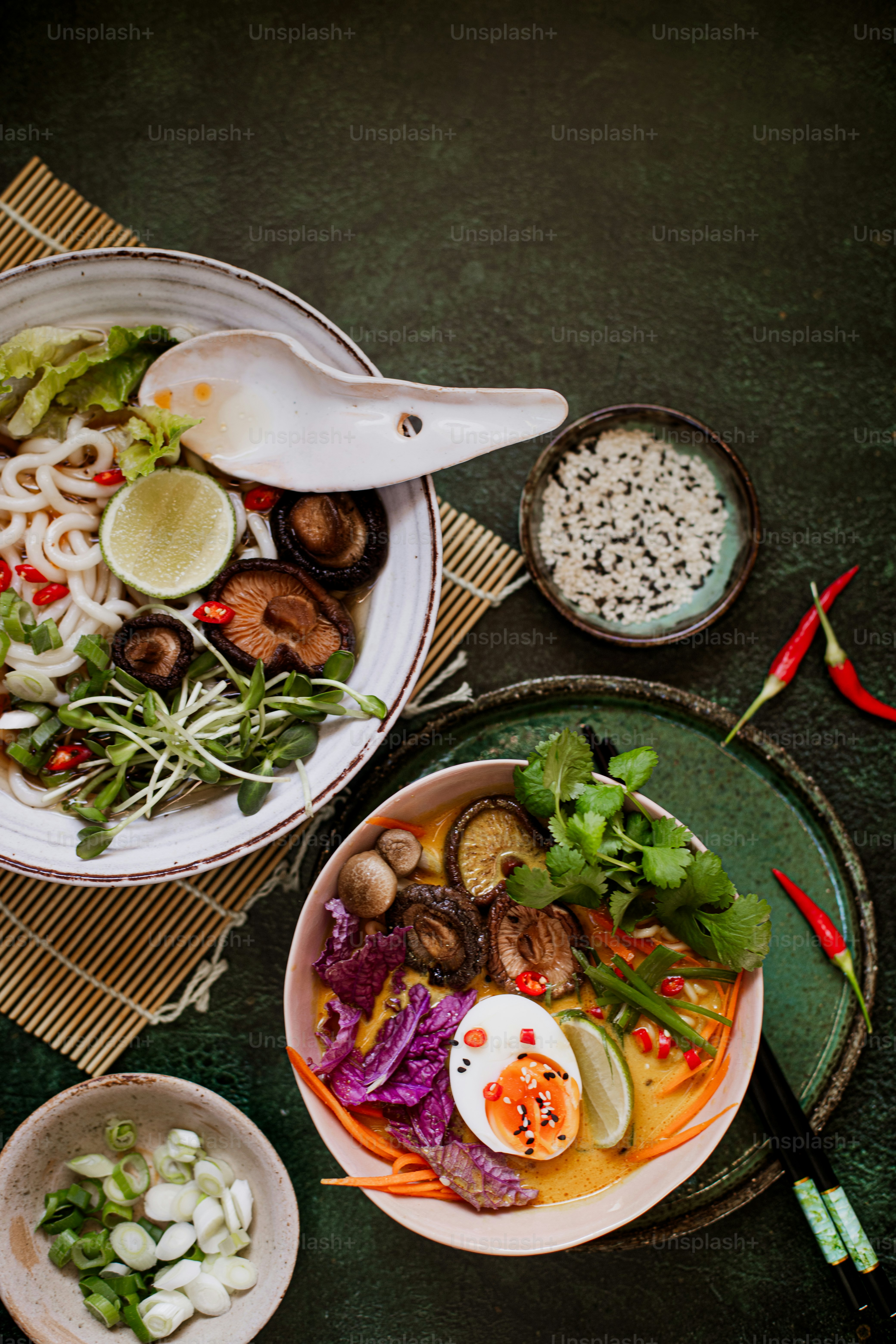a table topped with two bowls of food