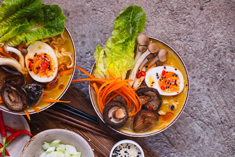 a table topped with bowls filled with different types of food