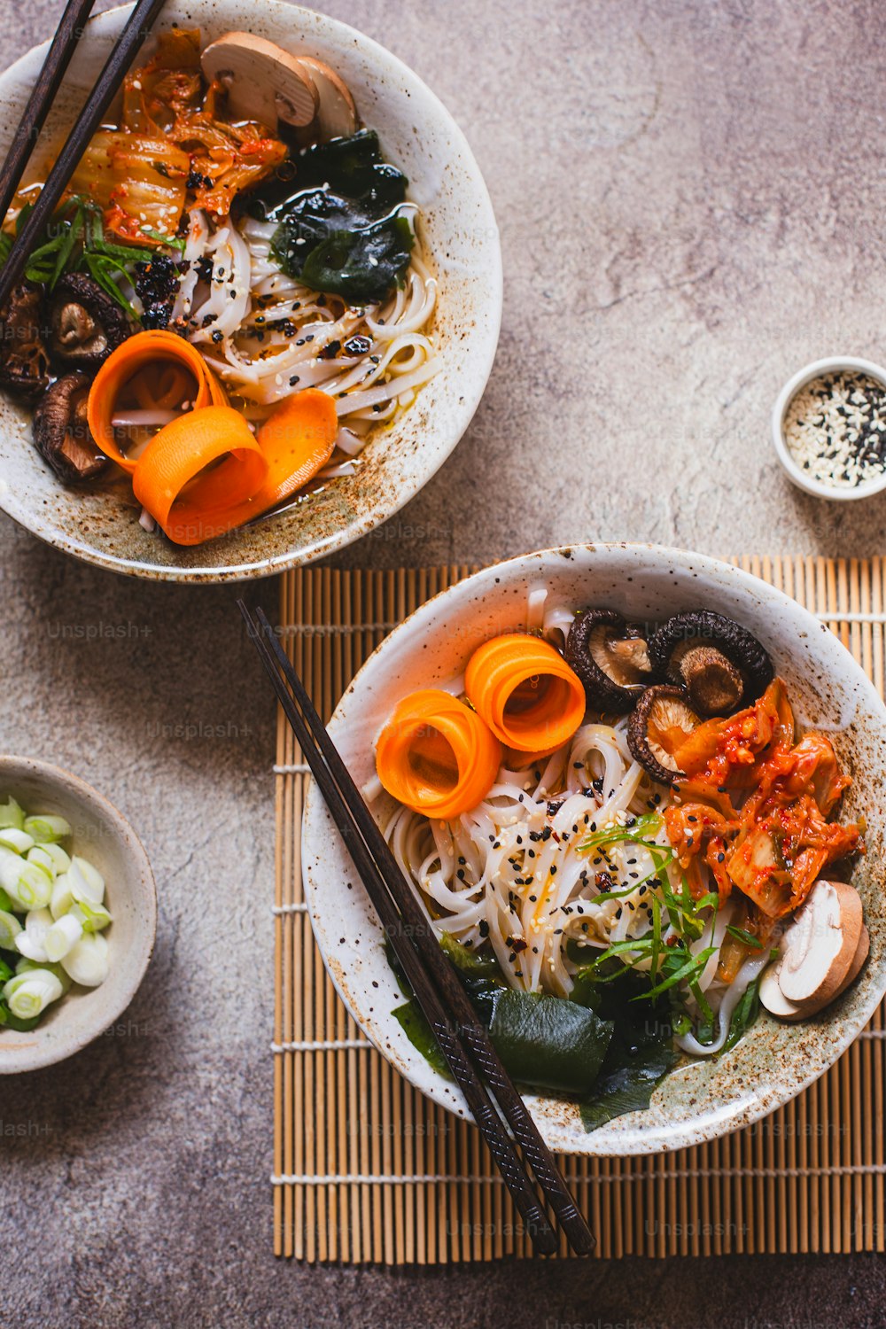 a couple of bowls of food on a table