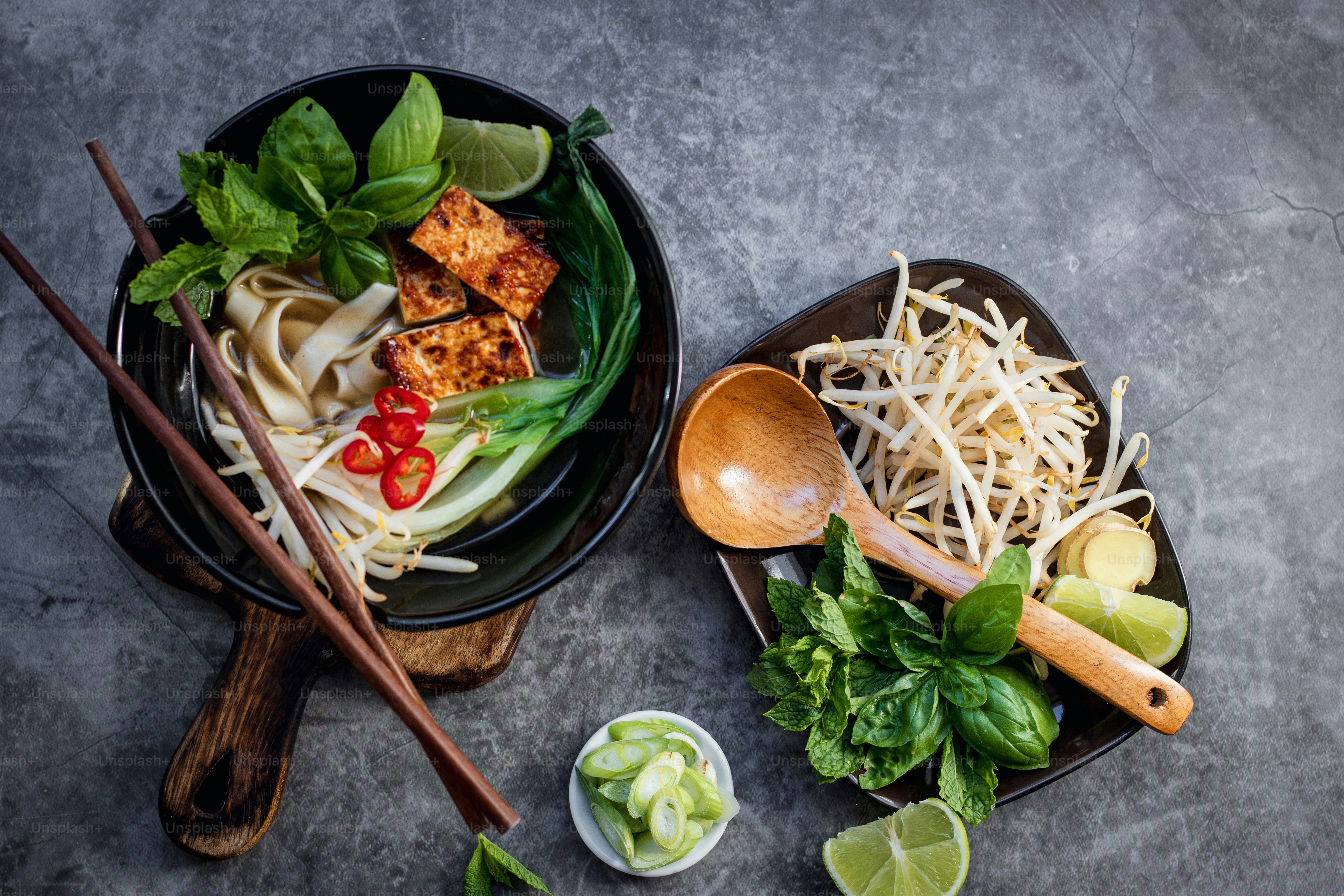 a couple of bowls of food on a table