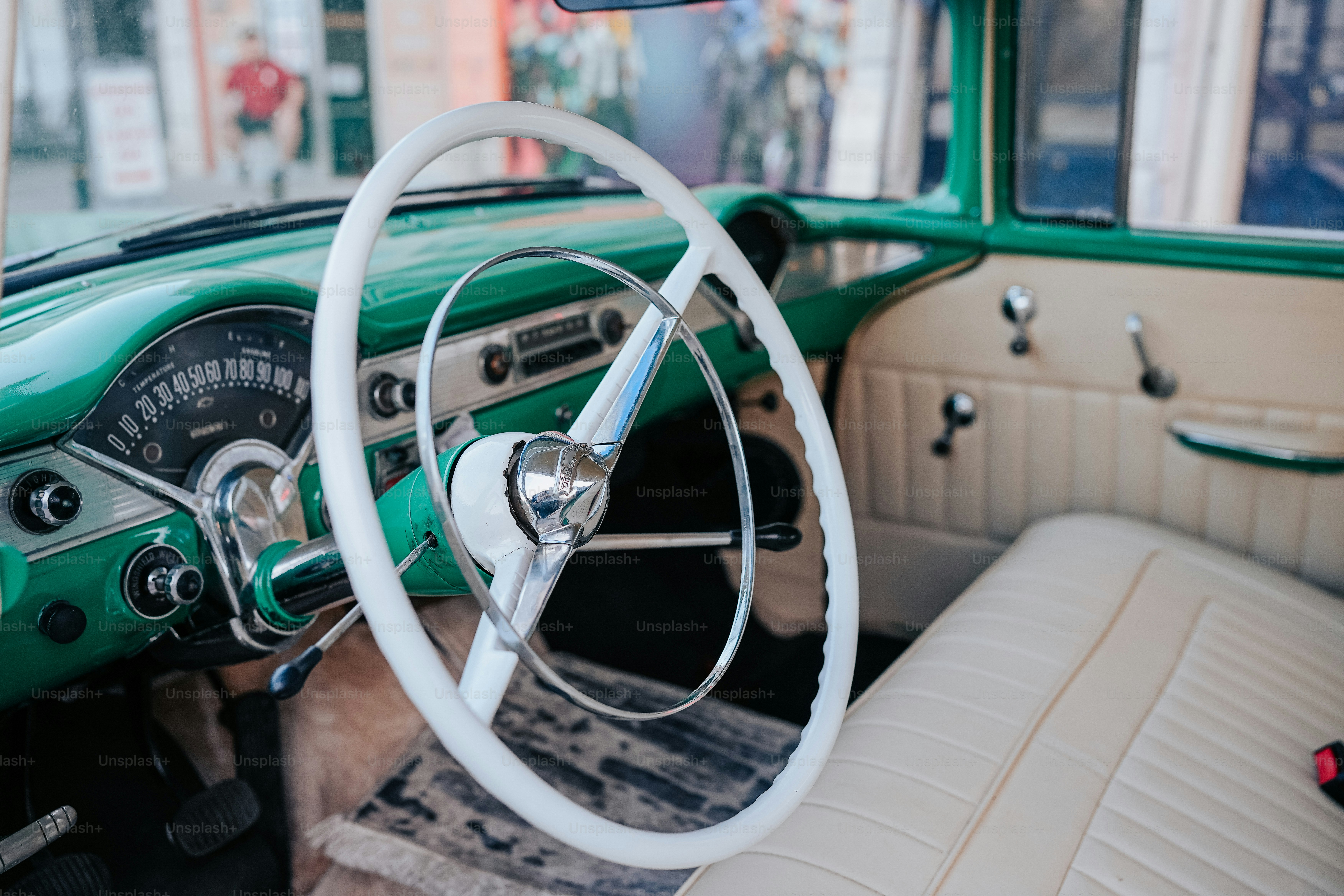 the interior of a car with a steering wheel and dashboard