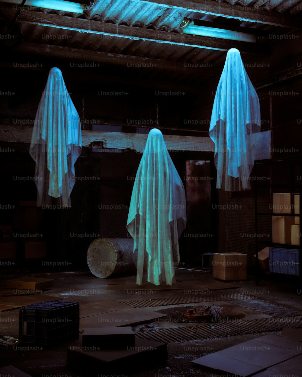 a couple of ghost statues in a dark room