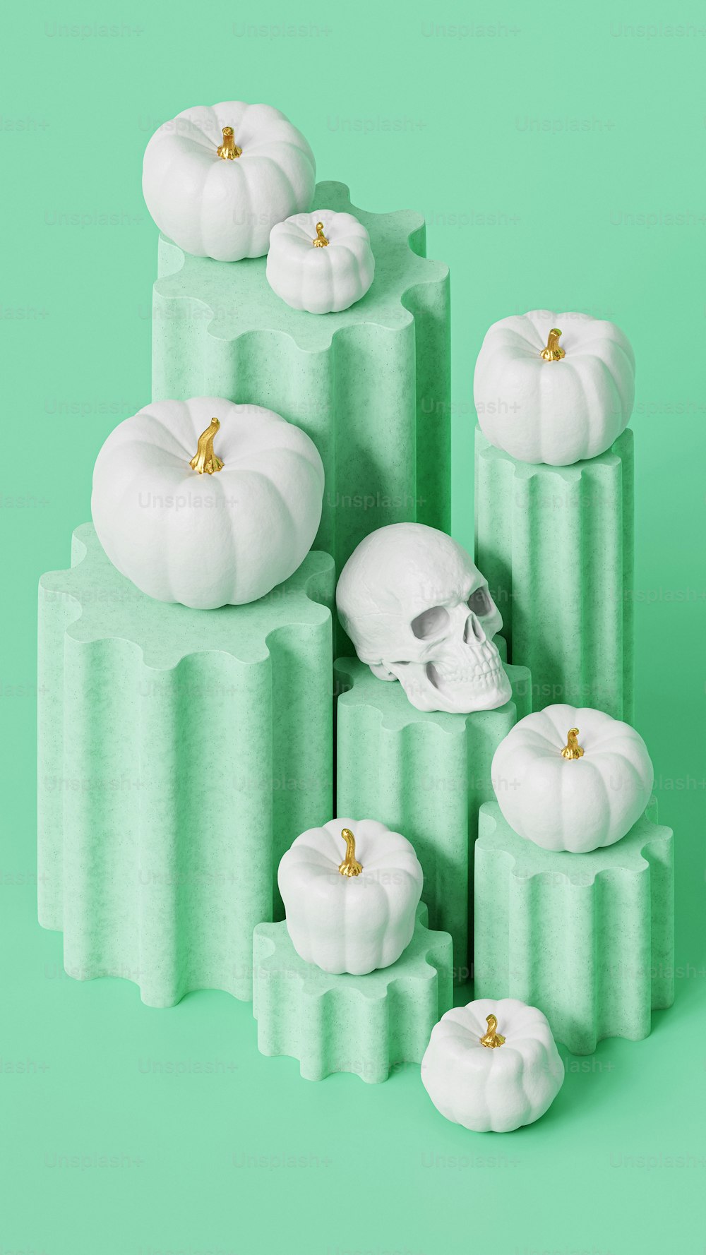 a pile of white pumpkins sitting on top of each other