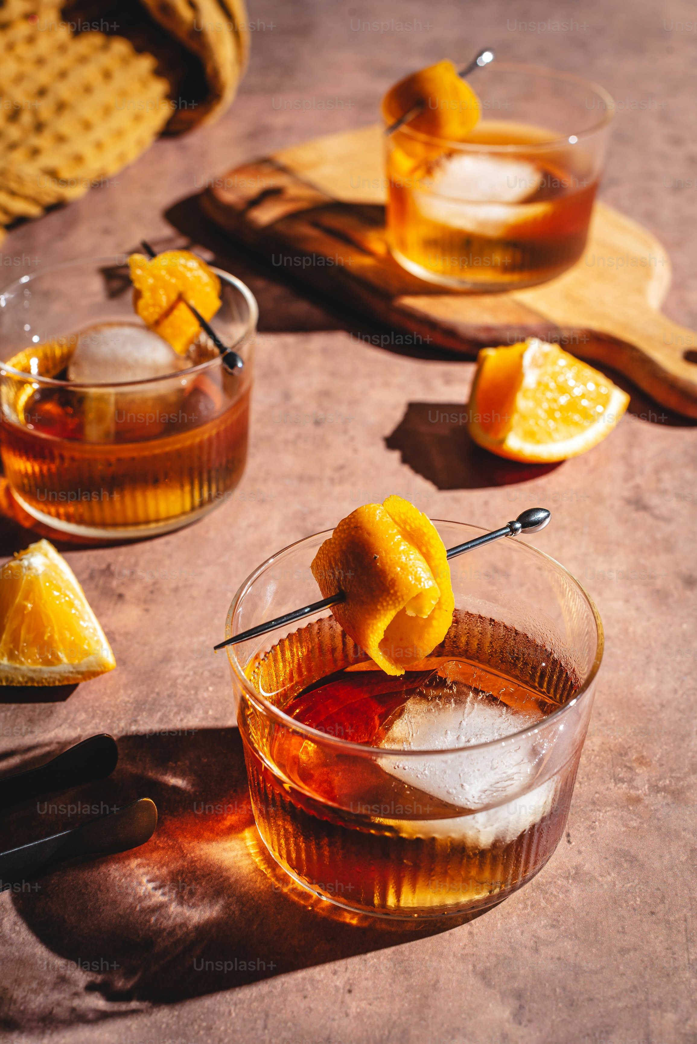 a table topped with glasses filled with drinks