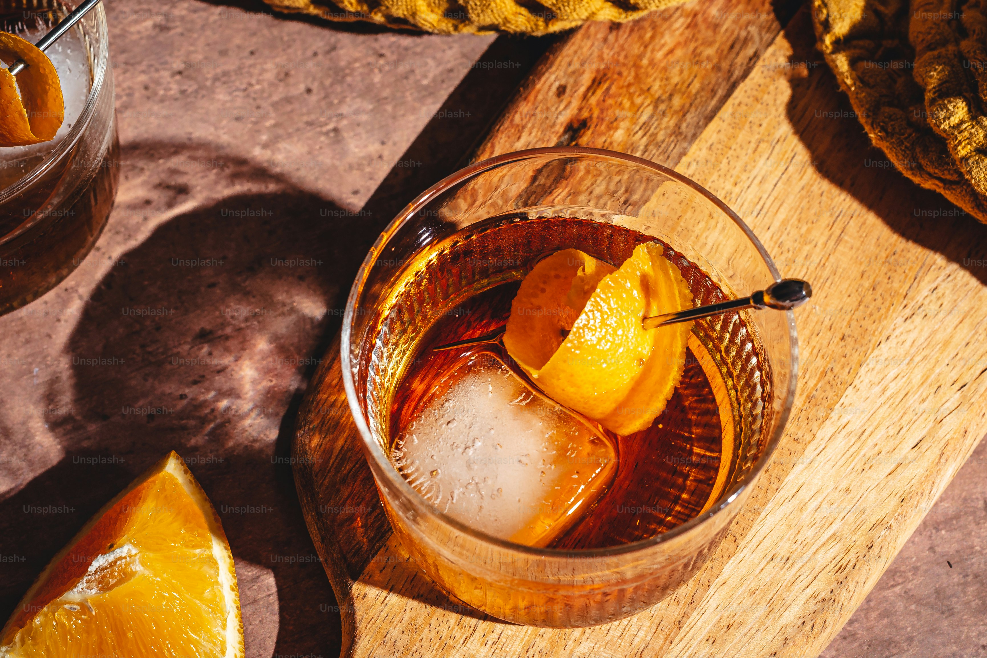 a glass filled with ice and orange slices