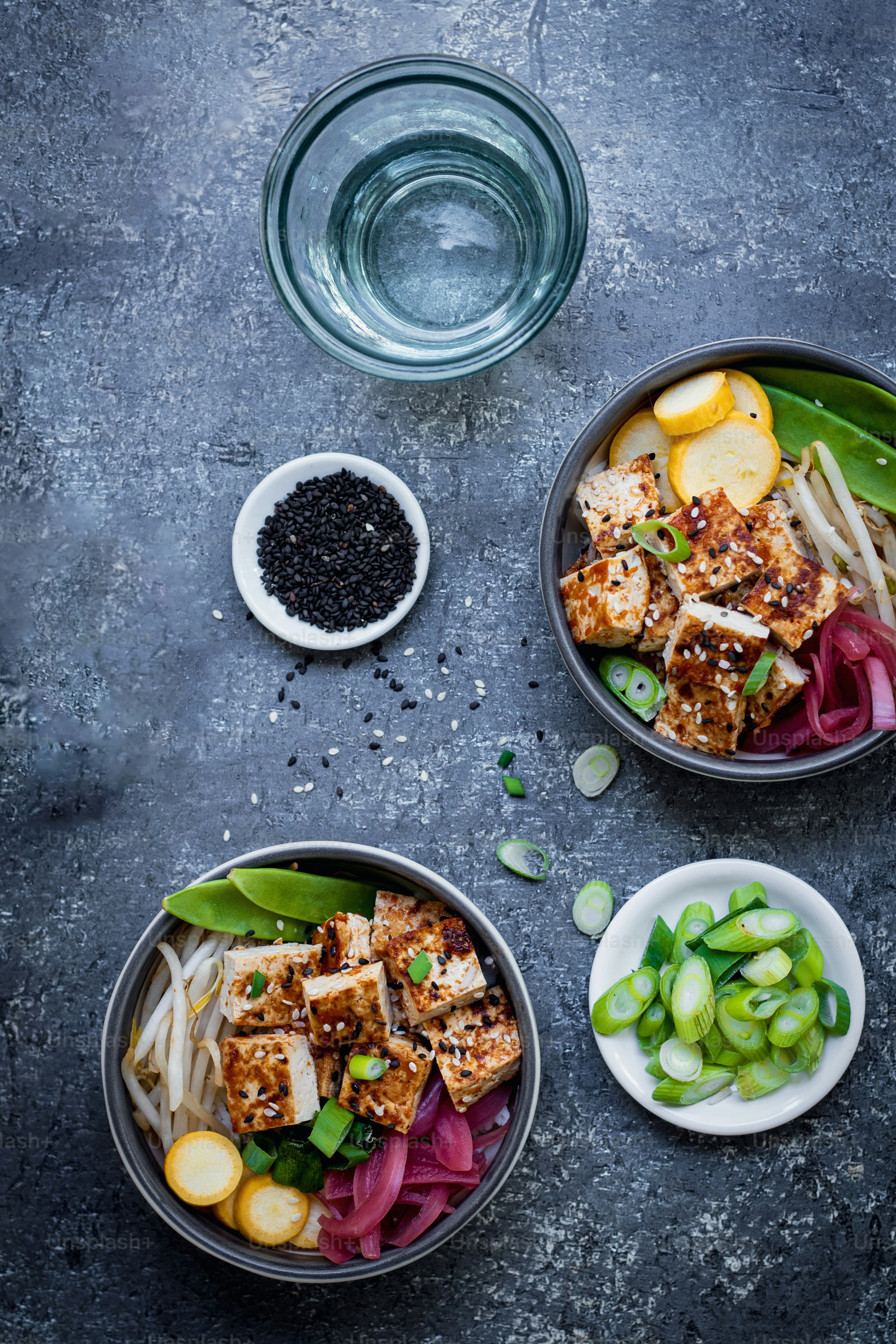 three bowls filled with food on top of a table
