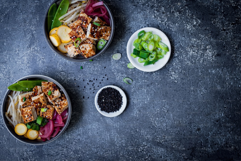 a couple of bowls of food on a table