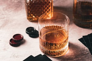 a close up of a glass of alcohol on a table