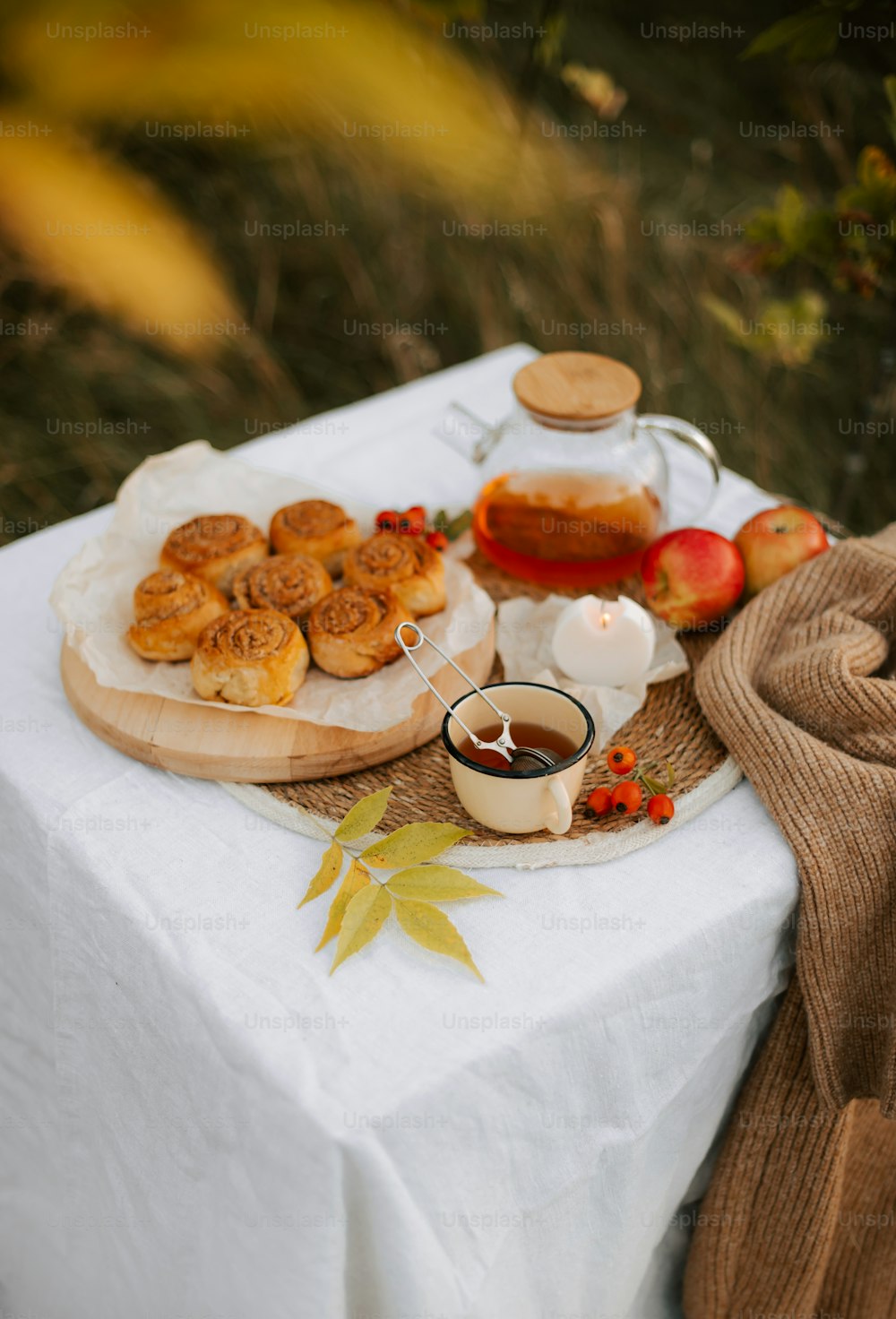 a table topped with a plate of food and a cup of coffee