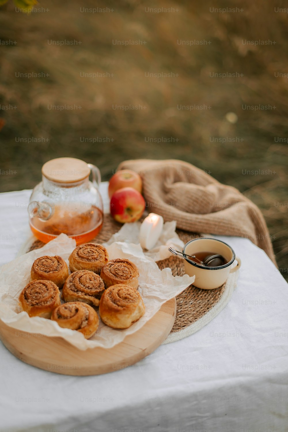 a table topped with a plate of food and a cup of tea